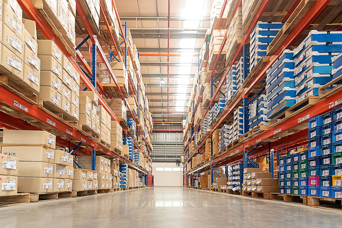 A large commercial warehouse with boxes and bins