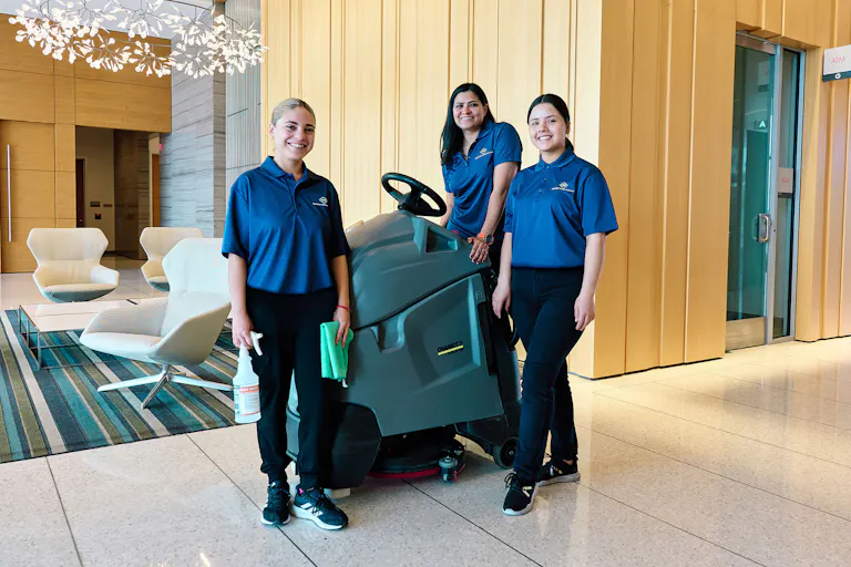 KBS crew members pose in a customer lobby