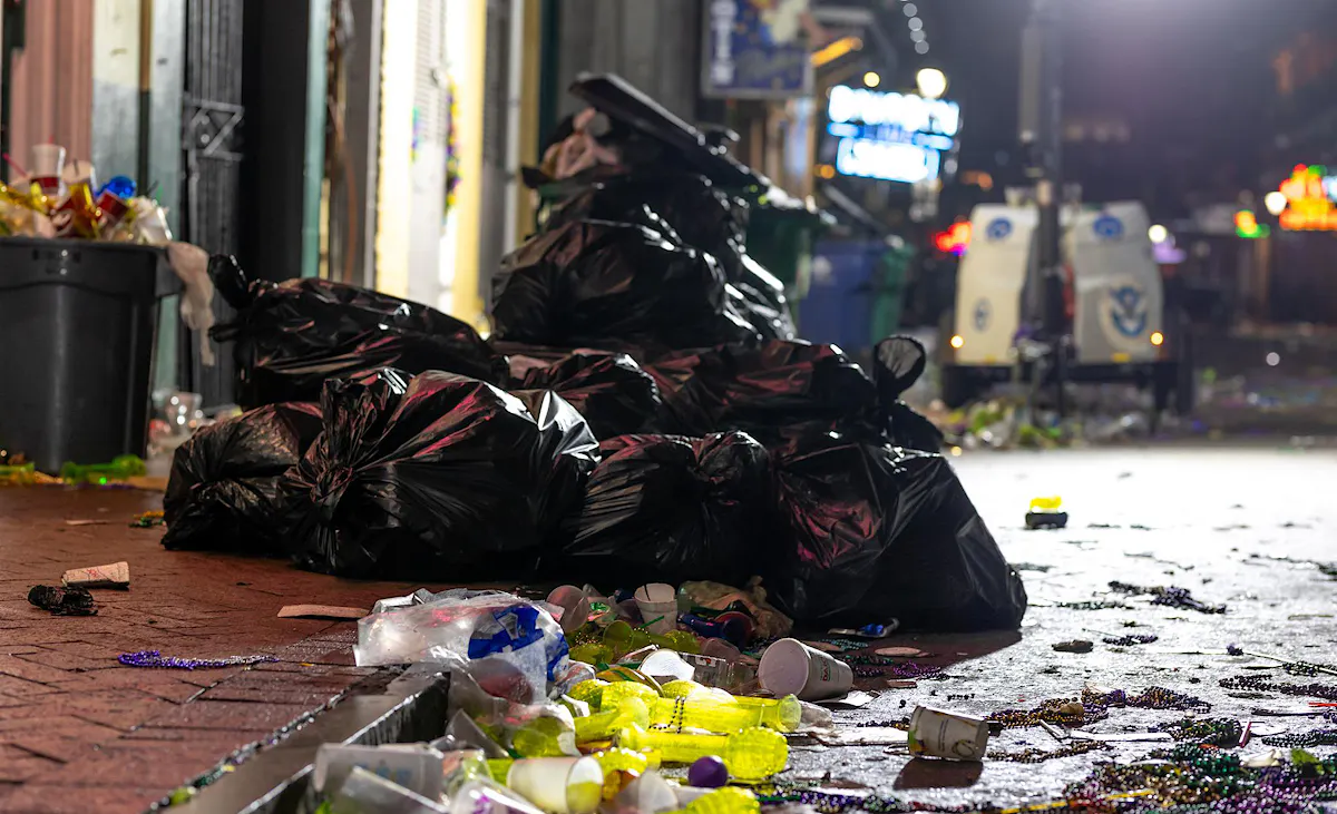 Trash in the streets following Mardi Gras