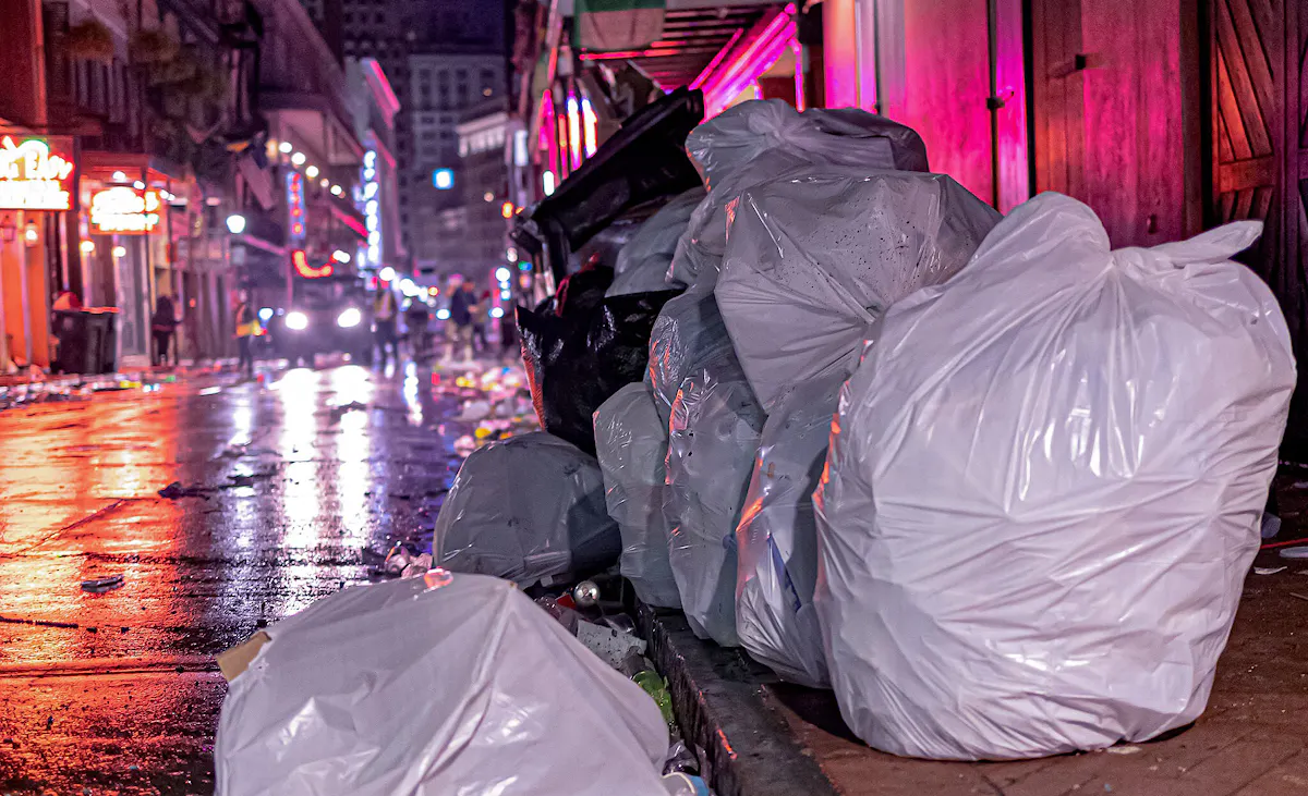 Trash in the streets following Mardi Gras